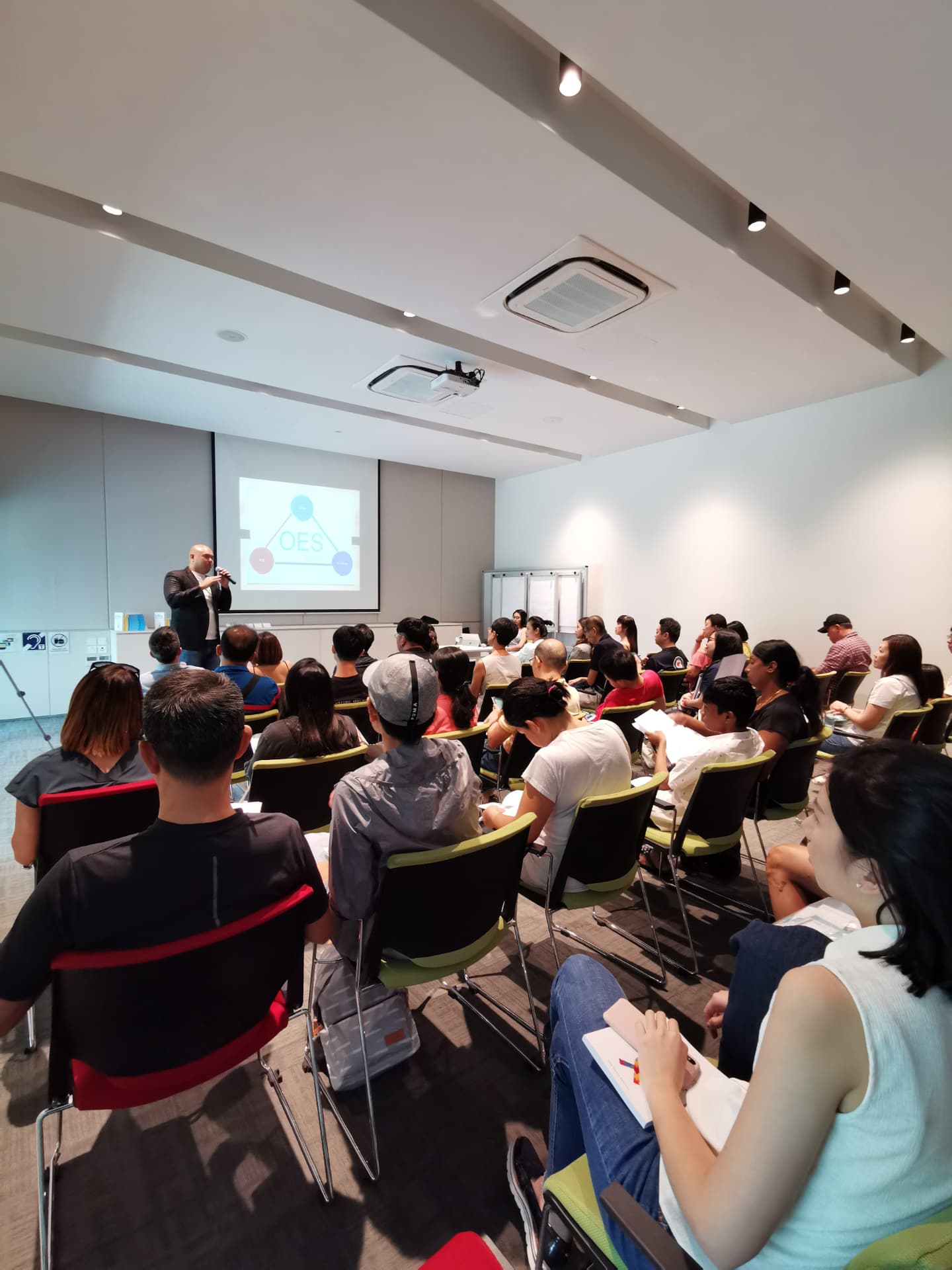 A full room of parents at a We Will community session