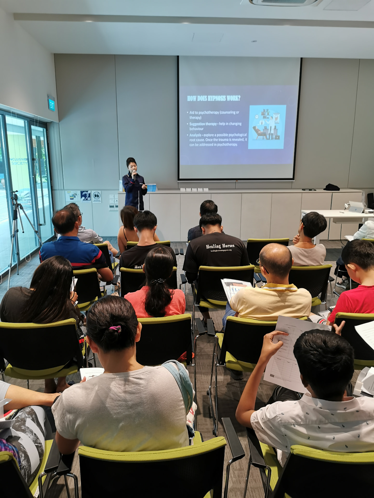 A guest speaker presenting to parents at a community talk